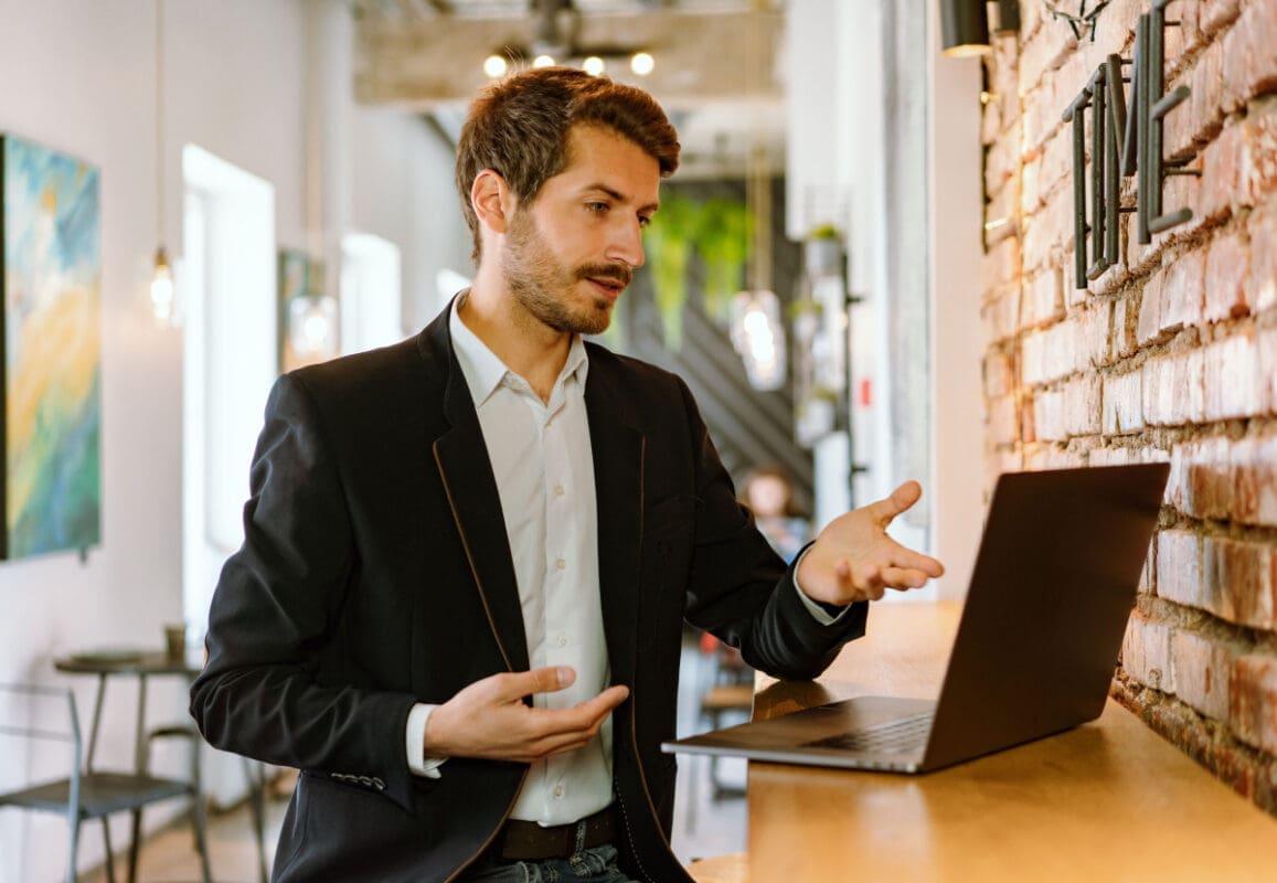 Person looking at a laptop and wondering why their website isn't attracting customers